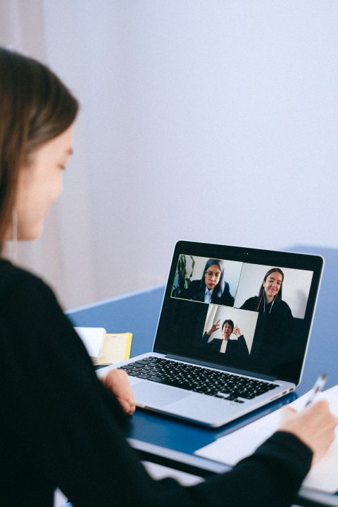 Student in front of laptop in a video call